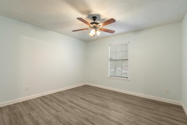 2214 Yaupon Dr, Tallahassee, FL 32303 - unfurnished room featuring dark wood finished floors, a ceiling fan, and a textured ceiling