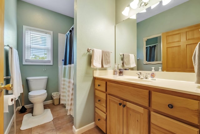 bathroom featuring vanity, a shower with curtain, tile patterned flooring, toilet, and baseboards