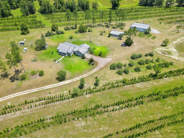 birds eye view of property featuring a rural view