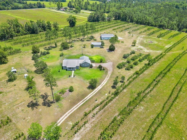 birds eye view of property featuring a rural view