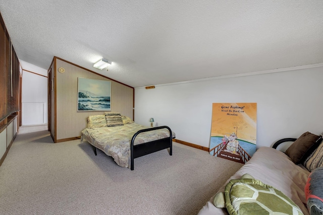 carpeted bedroom featuring crown molding, vaulted ceiling, and a textured ceiling