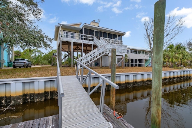 dock area with a water view