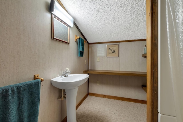 bathroom featuring sink and a textured ceiling