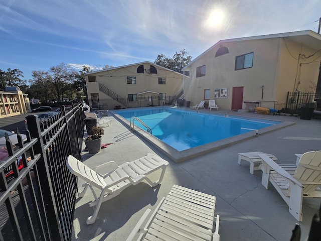 view of swimming pool featuring a patio area