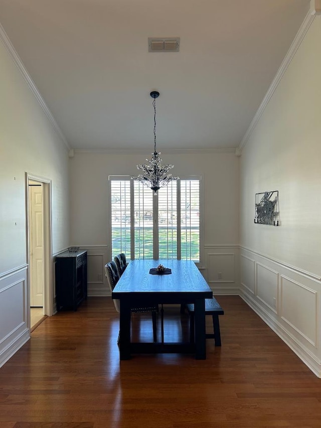 dining space featuring a chandelier, visible vents, crown molding, and dark wood-style floors