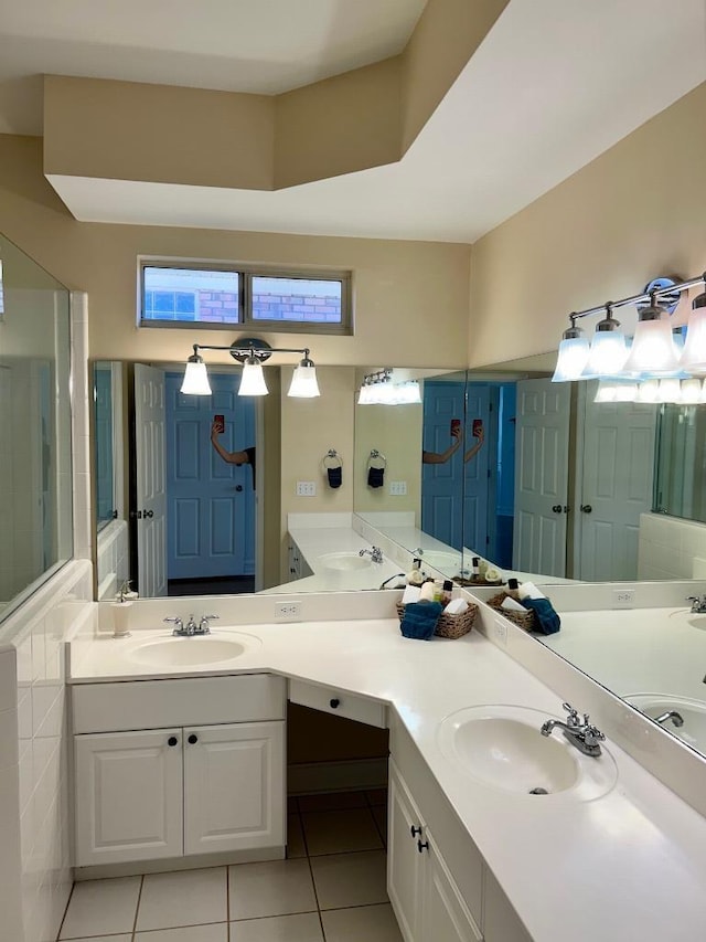 full bath featuring vanity and tile patterned floors