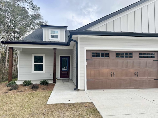 view of front of property with a garage and a front lawn