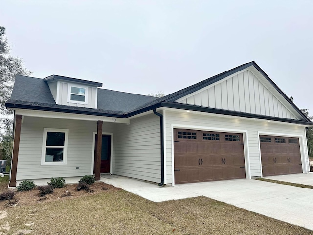 view of front of property with a garage and a front yard