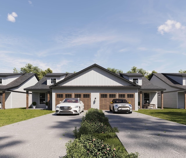 view of front of property featuring a front lawn and a garage