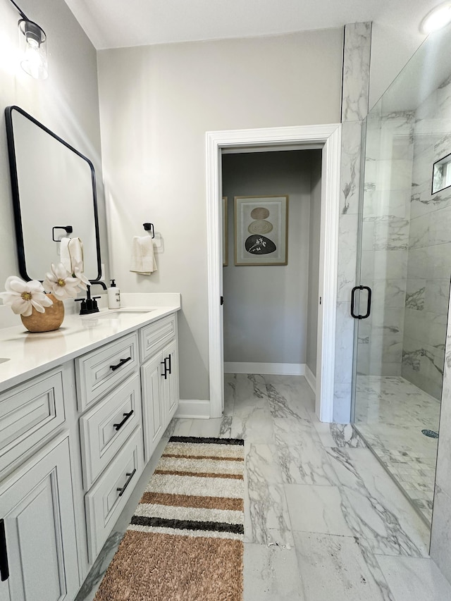 bathroom featuring vanity and an enclosed shower