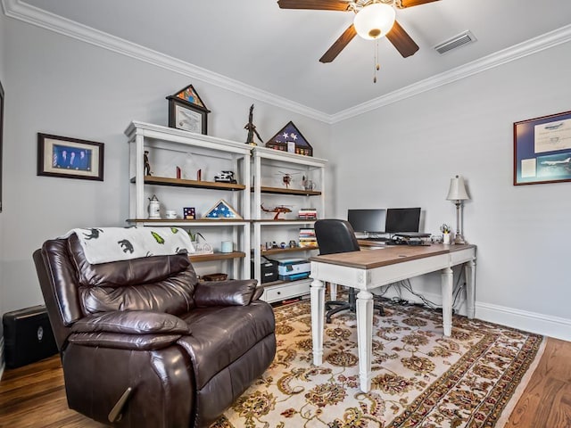 home office featuring hardwood / wood-style flooring, ornamental molding, and ceiling fan