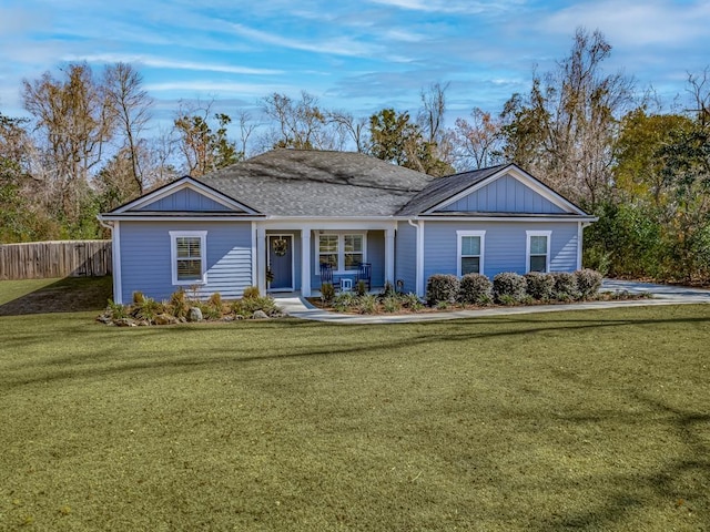 ranch-style home with a front yard