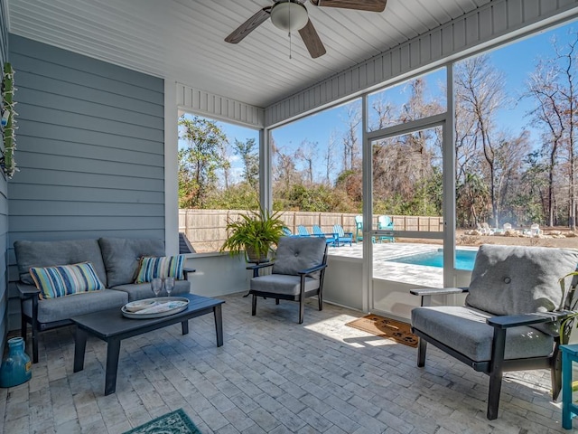 sunroom / solarium with ceiling fan