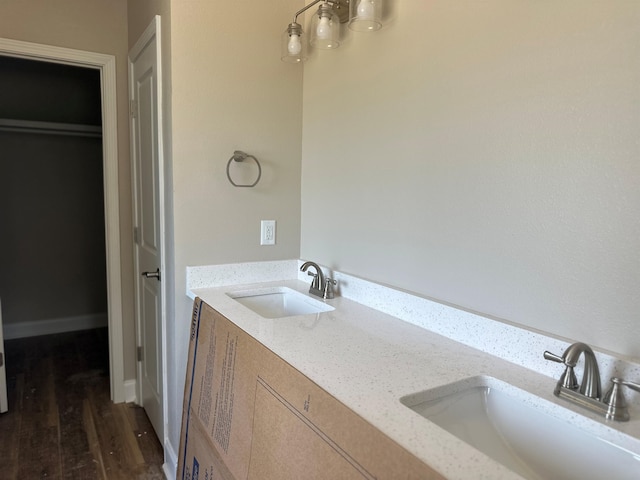 158 Woodridge Ln, Cairo, GA 39827 - bathroom featuring double vanity and wood finished floors
