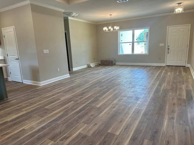 158 Woodridge Ln, Cairo, GA 39827 - unfurnished dining area featuring dark wood finished floors, baseboards, a chandelier, and ornamental molding