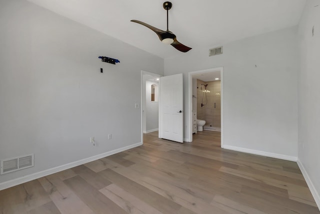 2801 Chancellorsville Dr Unit 236, Tallahassee, FL 32312 - unfurnished bedroom featuring light wood-type flooring, baseboards, ensuite bathroom, and a ceiling fan