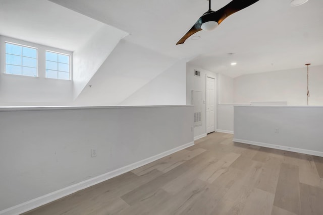 2801 Chancellorsville Dr Unit 236, Tallahassee, FL 32312 - empty room featuring light wood-style flooring, baseboards, vaulted ceiling, and recessed lighting