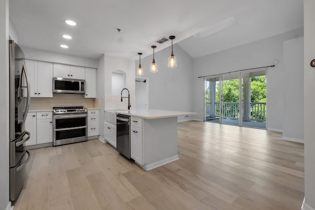 2801 Chancellorsville Dr Unit 236, Tallahassee, FL 32312 - kitchen with stainless steel appliances, a peninsula, light wood-style flooring, a sink, and light countertops