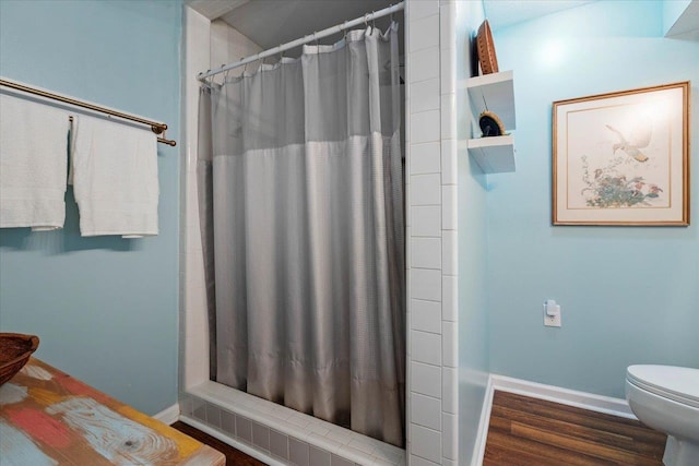 40 Carrol Dr, Crawfordville, FL 32327 - bathroom featuring baseboards, toilet, and curtained shower