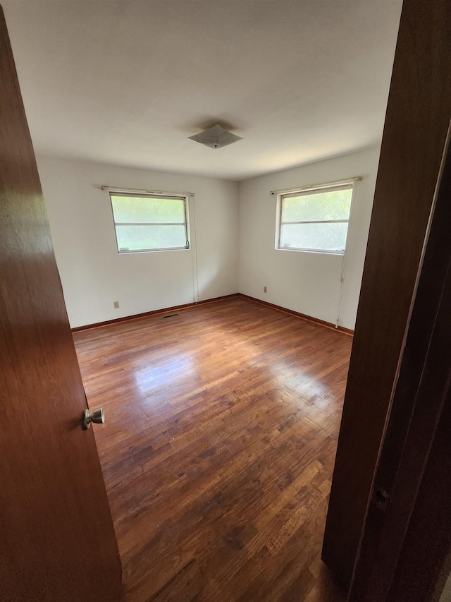 512 Hampton Ave, Tallahassee, FL 32310 - unfurnished room featuring baseboards and wood finished floors
