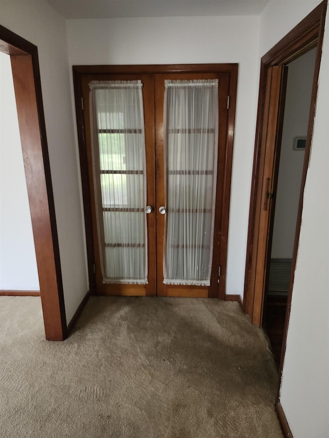 512 Hampton Ave, Tallahassee, FL 32310 - doorway with carpet flooring, french doors, and baseboards