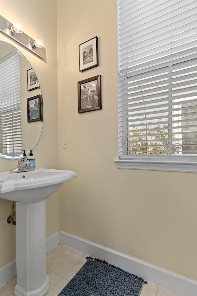 bathroom with sink and tile patterned flooring