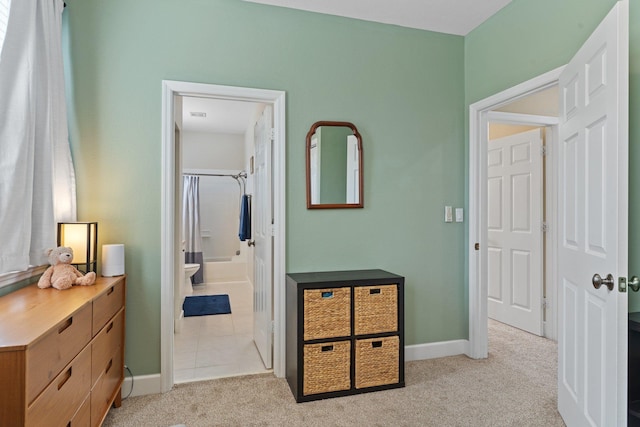 hallway featuring light carpet