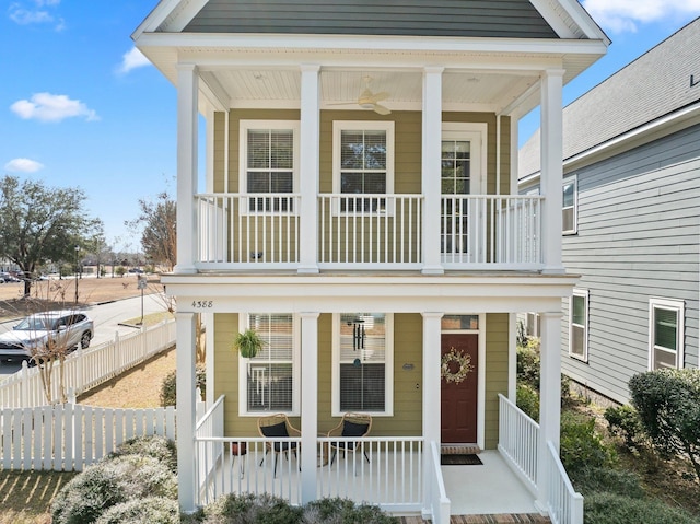 view of front facade with a balcony and a porch