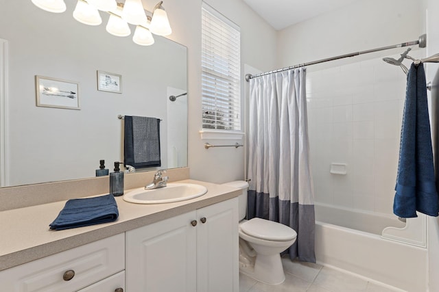 full bathroom featuring tile patterned flooring, vanity, toilet, and shower / bath combo with shower curtain