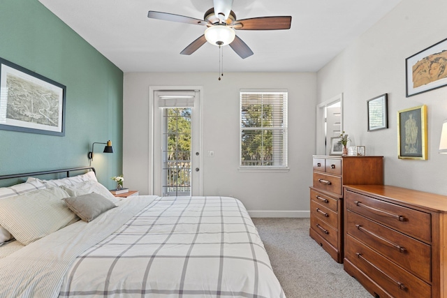 carpeted bedroom with access to outside and ceiling fan