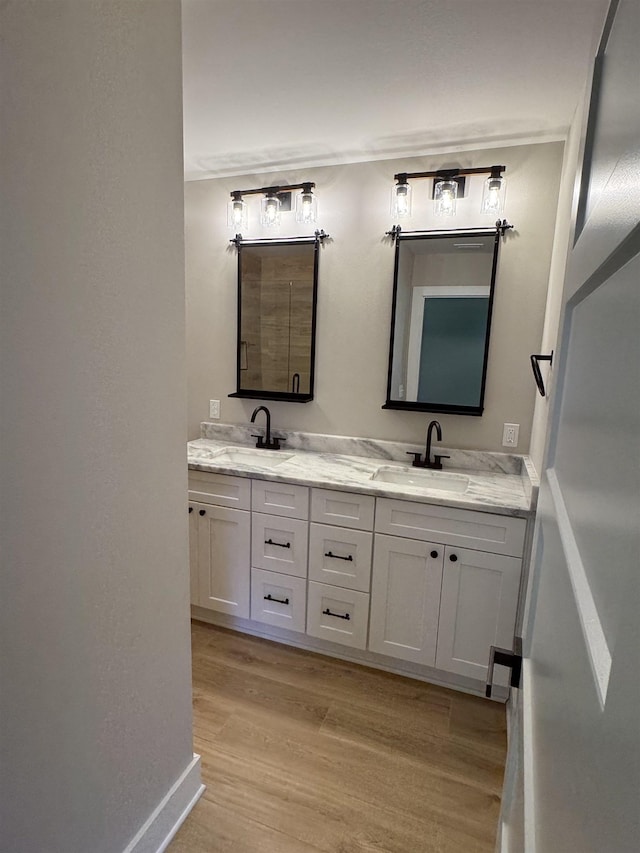 75 Chickat Trl, Crawfordville, FL 32327 - bathroom with double vanity and wood finished floors