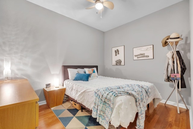 bedroom featuring ceiling fan and light hardwood / wood-style flooring