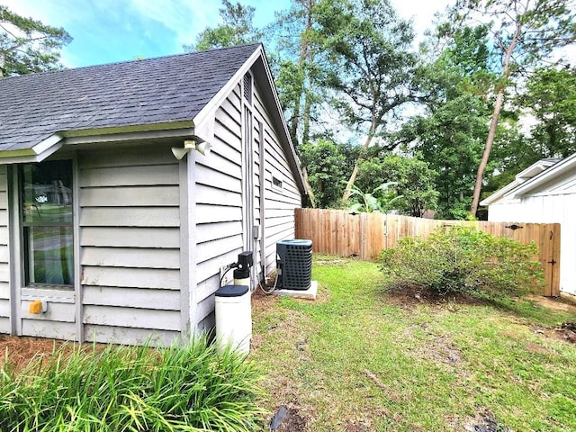2405 Lanrell Dr, Tallahassee, FL 32303 - view of property exterior with central air condition unit and roof with shingles