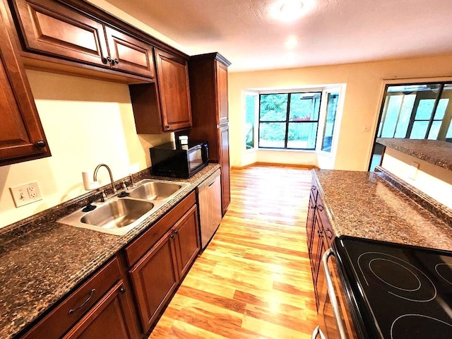 2405 Lanrell Dr, Tallahassee, FL 32303 - kitchen with black microwave, electric range oven, light wood-type flooring, a sink, and dishwasher