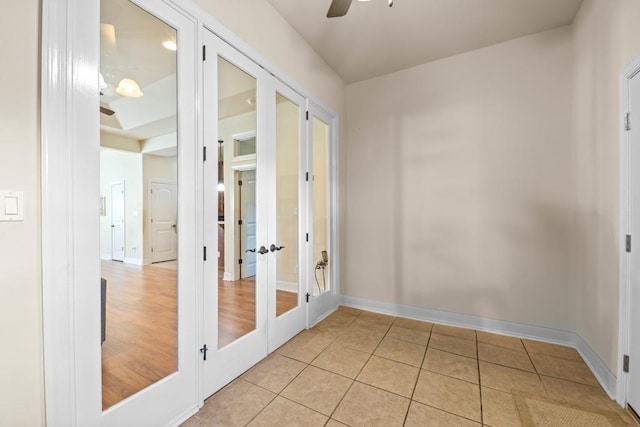 interior space featuring french doors, light hardwood / wood-style floors, and ceiling fan