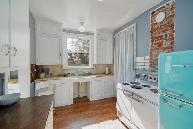 kitchen with white cabinetry, dark wood-type flooring, white electric range, backsplash, and fridge