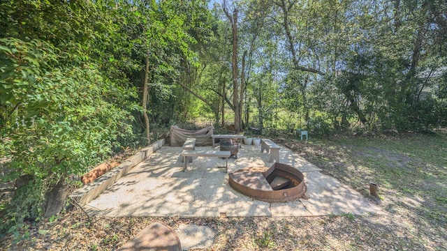 view of patio / terrace with a fire pit