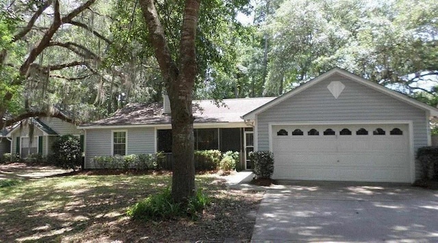 single story home featuring a garage