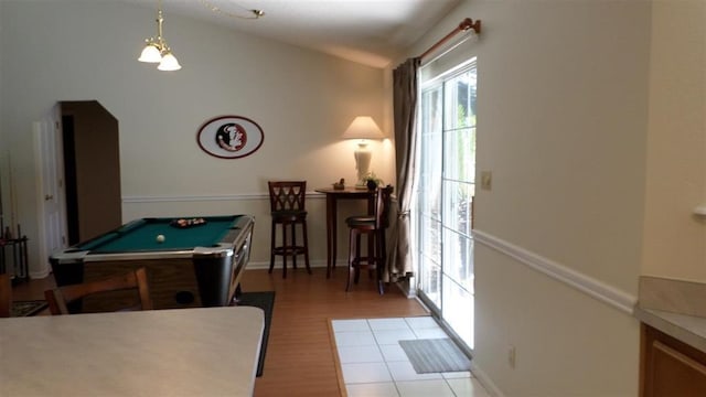 game room featuring vaulted ceiling, billiards, and light hardwood / wood-style floors