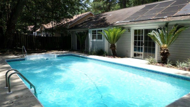 view of swimming pool with an outdoor structure