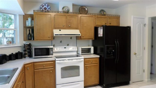 kitchen with sink, black refrigerator with ice dispenser, and white range with electric stovetop