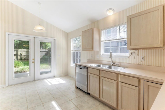 2942 Tewkesbury Trce, Tallahassee, FL 32309 - kitchen featuring stainless steel dishwasher, light brown cabinets, a sink, light countertops, and wallpapered walls