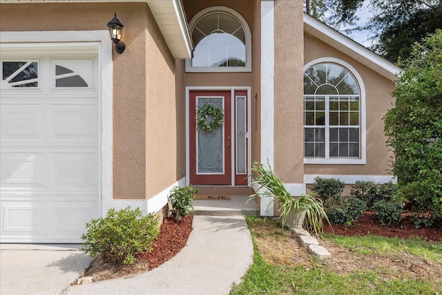 2942 Tewkesbury Trce, Tallahassee, FL 32309 - entrance to property with stucco siding and a garage