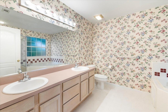 2942 Tewkesbury Trce, Tallahassee, FL 32309 - full bathroom featuring a garden tub, wallpapered walls, baseboards, double vanity, and toilet