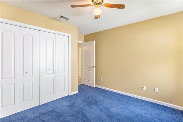 2942 Tewkesbury Trce, Tallahassee, FL 32309 - unfurnished bedroom with a closet, dark carpet, baseboards, and a ceiling fan