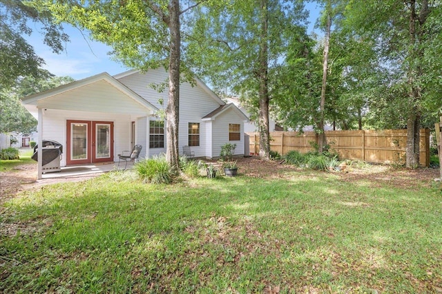 2942 Tewkesbury Trce, Tallahassee, FL 32309 - back of property featuring french doors and a patio