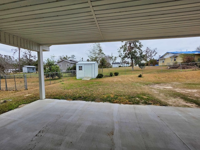 view of patio featuring a storage shed