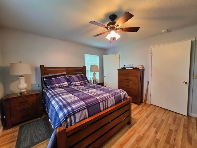 bedroom featuring ceiling fan and light hardwood / wood-style floors