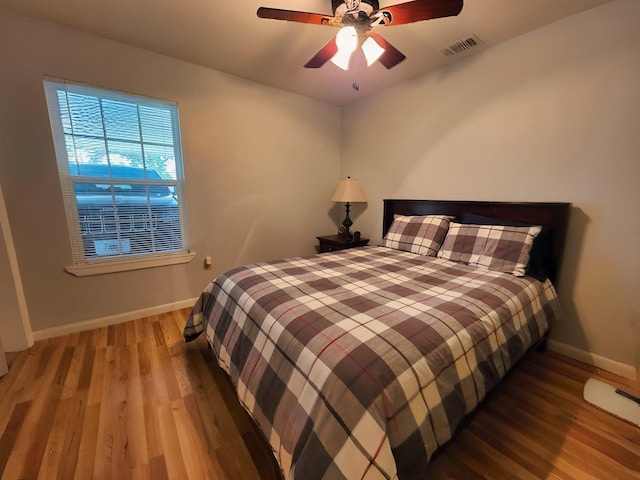 bedroom featuring hardwood / wood-style flooring and ceiling fan