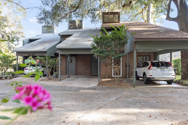 view of front of home with a carport